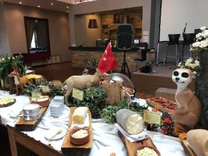a table full of food with skeletons and other foods at Riva's Club Hotel in Polonezkoy