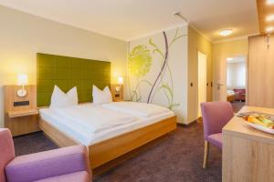 Postel nebo postele na pokoji v ubytování Hotel - Restaurant Erich Rödiger