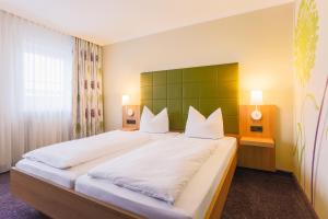 Postel nebo postele na pokoji v ubytování Hotel - Restaurant Erich Rödiger