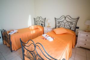 Llit o llits en una habitació de Villa Marchesa