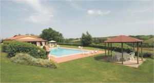 a swimming pool with a gazebo and a house at Agriturismo Marrucola in San Miniato