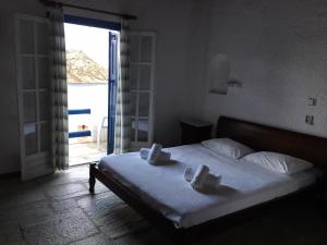Un pat sau paturi într-o cameră la Hotel Anastasia Village