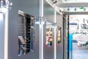 a door to a store with a window and a counter at Relais Trevi 95 Boutique Hotel in Rome