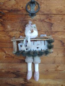 a santa claus ornament hanging on a wall at Chalet Xenia in Crans-Montana