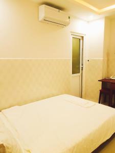 Postelja oz. postelje v sobi nastanitve Hotel Hoàng Thịnh