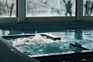 a pool of water with a person in it at Camping Venezia Village in Mestre