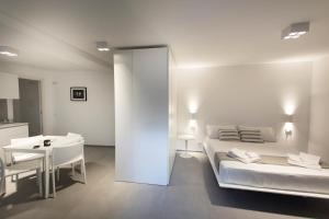 Posteľ alebo postele v izbe v ubytovaní Le Ancore Luxury Apartments