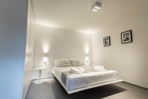 Posteľ alebo postele v izbe v ubytovaní Le Ancore Luxury Apartments