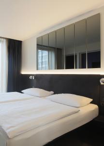 Postel nebo postele na pokoji v ubytování Hotel AMANO Grand Central