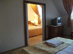 Postel nebo postele na pokoji v ubytování Hotel Rittinger