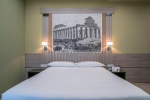 Postel nebo postele na pokoji v ubytování Hotel Palace
