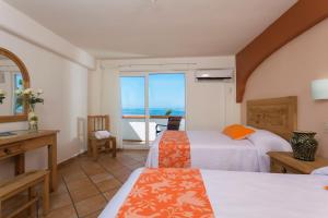 Postel nebo postele na pokoji v ubytování Hotel El Pescador + 37 fotografií