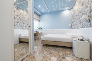 Postel nebo postele na pokoji v ubytování Hotel Palace