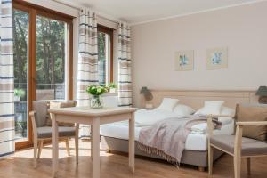 Ένα ή περισσότερα κρεβάτια σε δωμάτιο στο Villa Sosnowa