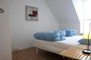 Ένα ή περισσότερα κρεβάτια σε δωμάτιο στο Skagen Apartment