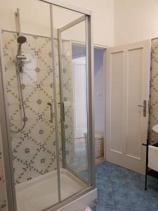 a shower with a glass door in a bathroom at Casa Migliaccio in Sorrento
