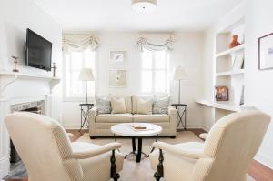 a living room with a couch and chairs at Zero George Hotel in Charleston