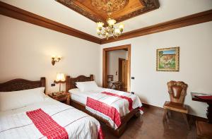 Postel nebo postele na pokoji v ubytování Brilant Antik Hotel