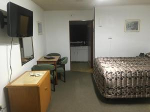 TV a/nebo společenská místnost v ubytování New Haven Motel