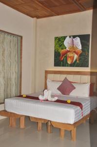 Posteľ alebo postele v izbe v ubytovaní Crystal Beach Bali