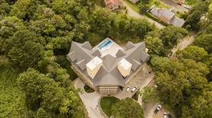 an aerial view of a house with a pyramid shaped roof at Sky Serra Hotel in Gramado