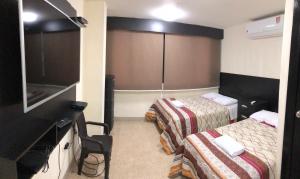 Ένα ή περισσότερα κρεβάτια σε δωμάτιο στο residencia terreros ideal 4 personas