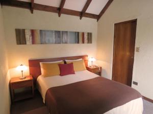 Un pat sau paturi într-o cameră la Hotel 5 Norte