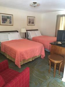 Säng eller sängar i ett rum på Anchor Motel