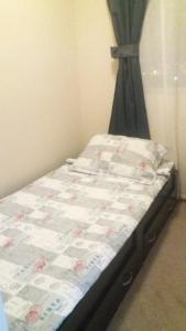 Ένα ή περισσότερα κρεβάτια σε δωμάτιο στο Departamento La Serena