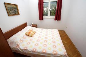 Postel nebo postele na pokoji v ubytování Apartment Toma
