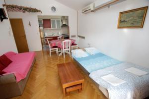 Postel nebo postele na pokoji v ubytování Apartment Toma