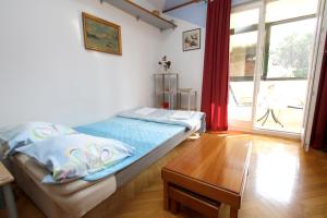 Postel nebo postele na pokoji v ubytování Apartment Toma