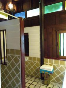 a bathroom with a fire hydrant in a room at Sea Pines & Liberg in Nai Yang Beach