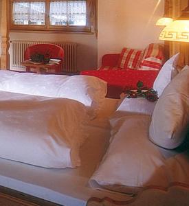 Postel nebo postele na pokoji v ubytování Hotel Garni San Nicolò