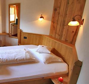 Postel nebo postele na pokoji v ubytování Hotel Garni San Nicolò