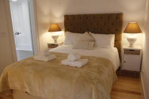 a bedroom with two towels on a bed with two lamps at Augusta Street 213 - 4 Dto in Lisbon