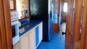 Kuchyň nebo kuchyňský kout v ubytování Parcela privada con piscina en Olmué