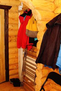 a closet with a pile of clothes on a wall at Sadyba Kazkove Dzherelo in Verkhovyna