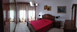 Postel nebo postele na pokoji v ubytování B&B Le Palme d'Oro