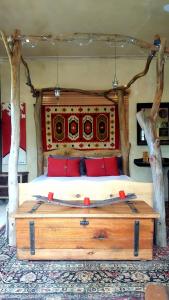 a bedroom with a large bed with trees on it at Frieden-Hof Guest Accommodation in Penhill