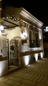 a building with a gate at night with lights at Villa Skadarlija in Belgrade