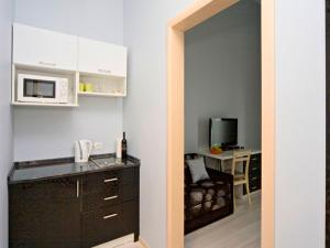 Кухня или мини-кухня в Best Season Apart Hotel
