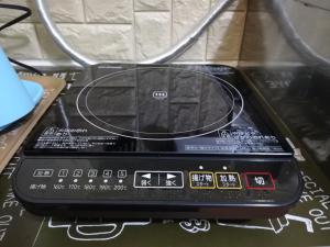 a close up of a toaster oven with a control panel at Apartment Namba Daikoku in Osaka