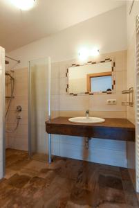 a bathroom with a sink and a mirror at Jugendgästehaus Gruber in Grossarl