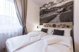 Posteľ alebo postele v izbe v ubytovaní Apartament Piaseckiego Centrum