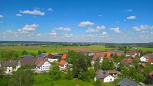 an aerial view of a village with houses and trees at Allgäuer Appartements in Lachen