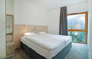 Posteľ alebo postele v izbe v ubytovaní Apartamenty Willowa + 37 fotografií