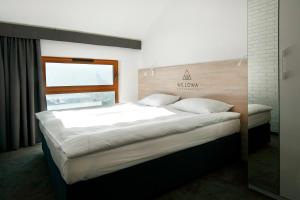 Posteľ alebo postele v izbe v ubytovaní Apartamenty Willowa