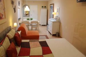 a bedroom with a bed and a living room at Tanja's B&B in Maastricht +4 photos