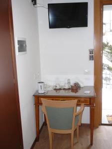 TV a/nebo společenská místnost v ubytování Casa Screm - Appartamenti e Camere -Rigolato - UD